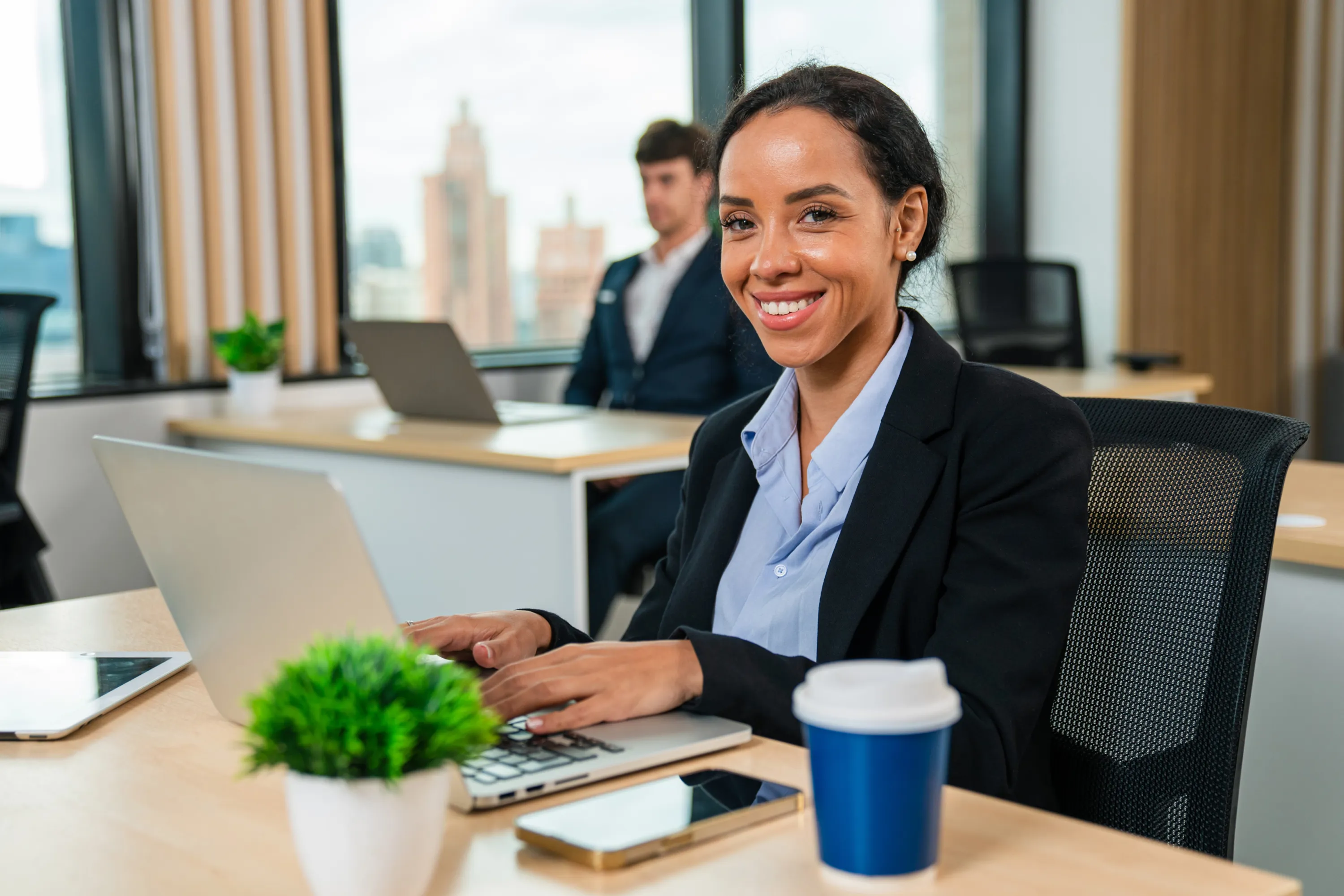 Smiling Woman Working At Laptop In Bright Office 2026 03 15 23 22 42 Utc